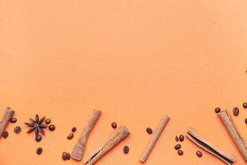 Composition with cinnamon sticks and coffee beans on color background