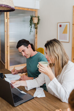 Couple Paying Bill At Home