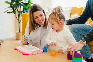 Loving Family Playing And Learning At Home