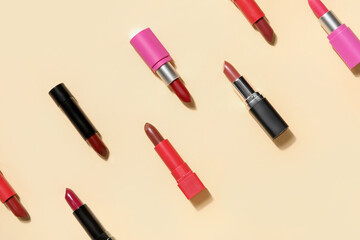 Obraz premium Different lipsticks on yellow background