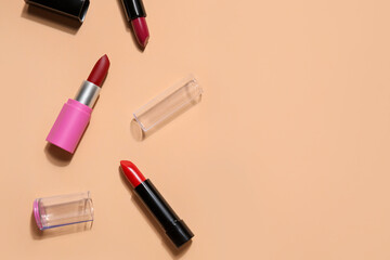 Obraz premium Different lipsticks on beige background