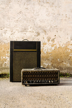 Vintage guitar amplifiers against wall