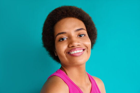 Portrait of smiling woman on green background