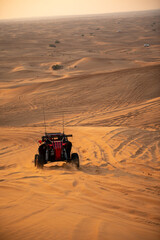 Offroad dune buggy desert safari trip in Dubai at sunset