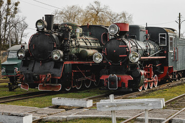 Fototapeta premium Classic steam engine at an open-air railway yard.
