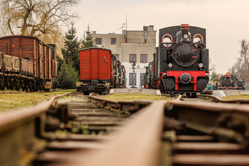 Steam locomotive and trains at the railway station.