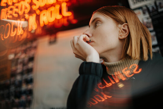 Red Hair Woman Relaxing In Cafe