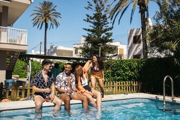 Friends gathering by the pool in summer