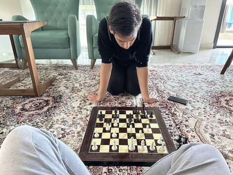 Playing chess in living room