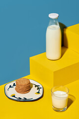 Cookies and milk placed on geometric shapes