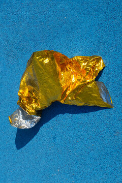 Golden metallic folio on a  blue sport running track