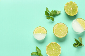 Fresh lime and slices frozen in ice with mint on blue background