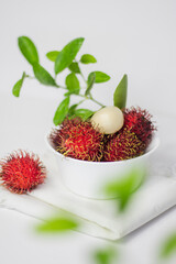 Rambutan fruit on a bowl