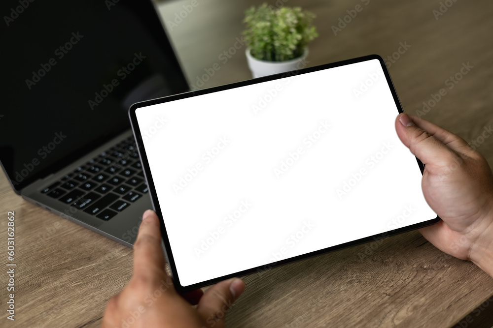 Poster digital tablet computer close up man using tablet hands man multitasking with isolated screen