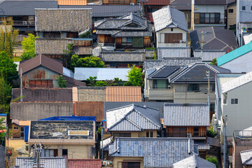 Looking down on roofs of old houses in small town Japan - 603163220
