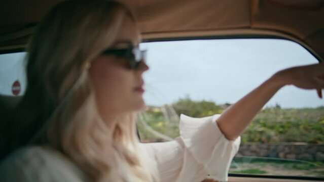 Woman tourist riding car stretch hand in open window close up. Driver travelling