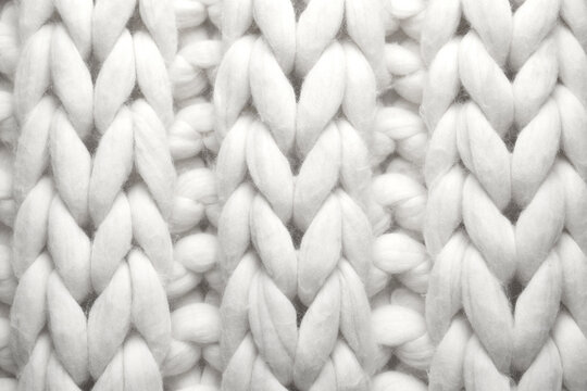 White knitted fabric as background, top view © New Africa