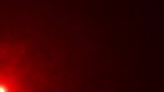 Abstract loop glow red energy smoke clouds flow to top right animation art on black background. Lighting lamp rays effect dynamic red hue color bright 