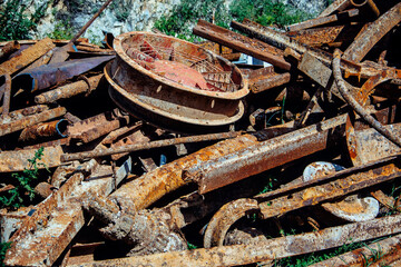 Close-up of a pile of rusty scrap metal. Metal waste for recycling.  Details of old machines and mechanisms.