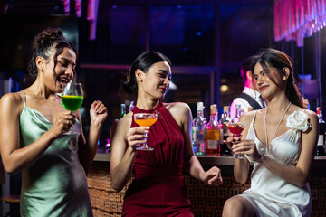 Asian beautiful women having fun, meeting each other in bar restaurant.