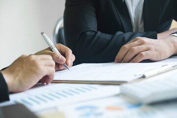 Business man sign a contract investment professional document agreement.