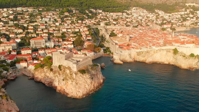 An aerial view of a Dubrovnik Old Town, fortress and surrounding neighbourhood