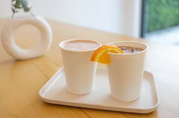Two Cups of Iced and Hot Chocolate Served on Table in Restaurant