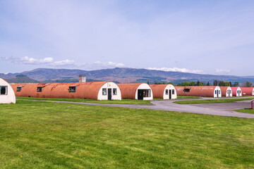 Quonset huts of world war two vintage shot in a former prisoner of war camp in scotland mountains...
