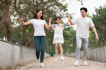 Young Asian family in the park