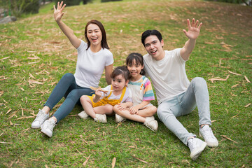 Young Asian family in the park