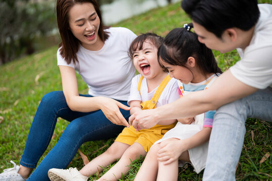 Young Asian family in the park