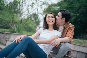 Naklejka premium Photo of young Asian couple outside