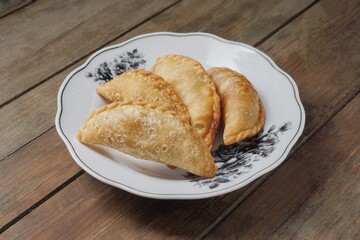 Traditional Curry Puff or Malay people called Karipap filled with potato filling