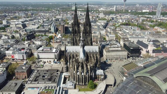 Aerial view of K&ouml;llner Dome Cathedral, Museum Ludwig and Cental Train Station, Cologne City.
Two Trains traversing oppositely on Bridge Railway tracks over Rhine River.