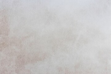 Fototapeta premium photo of beige leather texture faded by exposure to the sun until it is colorless