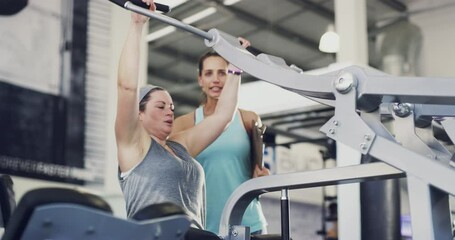 Gym, woman and personal trainer do exercise, workout or training together to lose weight and be healthy. Coach and plus size client person for motivation or support on rowing machine for wellness - Powered by Adobe