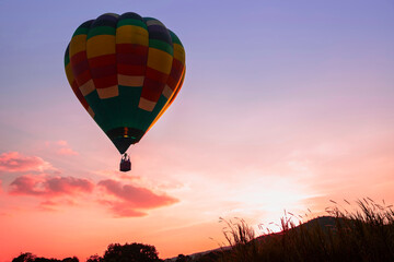 landscape with hot air balloons flying over mountain valley in sunlight.  travel concept background, romantic holiday on balloon.