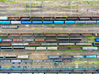 Aerial view landscape. View of trains, railroad tracks, cars, cargo. Photo from a drone. Coal transportation.