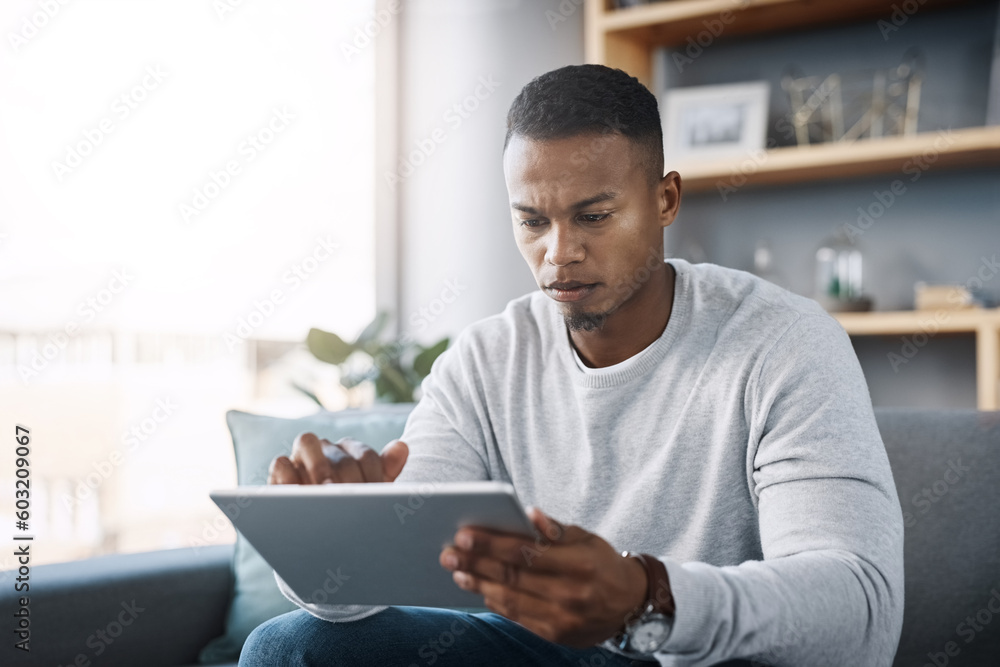 Poster scroll, tablet and man on couch search social media, reading email or streaming video on subscriptio