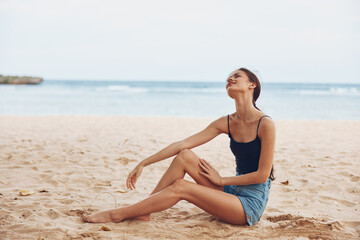 Fototapeta na wymiar woman smile sea sand travel freedom nature sitting vacation relax beach