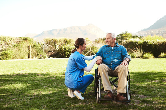 Senior man, nurse and wheelchair in nature for healthcare support, life insurance or garden at nursing home. Happy elderly male and woman caregiver helping person with disability or patient outdoors