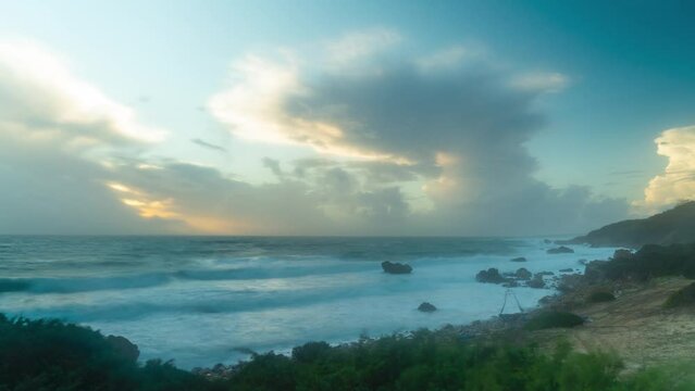 Rocky Spain coastline and flowing clouds in sky, time lapse view