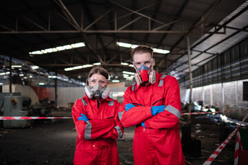 Fototapeta na wymiar Portrait happiness industry workers with safety uniform ,blue glove and helmet to safety before start work to check chemical or gas in factory is industry safety concept.