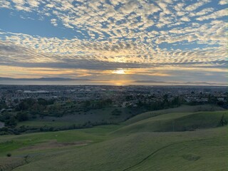 sunset in the hills with clouds