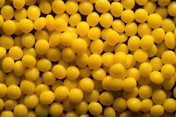  a close up of a bunch of yellow candies in a bowl of yellow candies in a bowl of yellow candies in a bowl, yellow candies, yellow candies, candies, candies, candies, candi.  generative ai