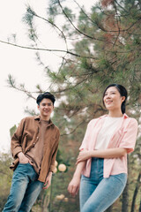 Naklejka premium Portrait of young Asian couple outside