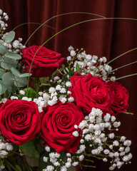 Bouquet of large red ro with white flowers. Close-up. Postcard, Congratulations. Still life