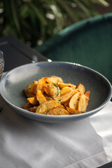 Potato country style with dill in bowl. Healthy diet food. copy space.