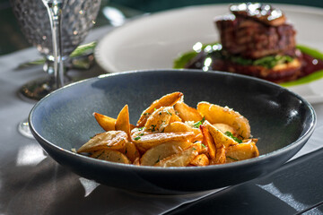Potato country style with dill in bowl. Healthy diet food. copy space.