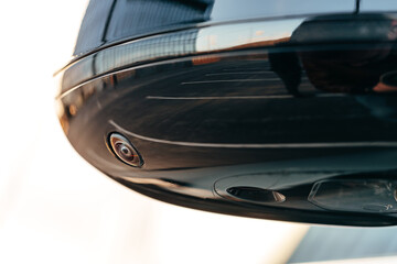 Obraz premium Side view of a mirror of a modern luxury car